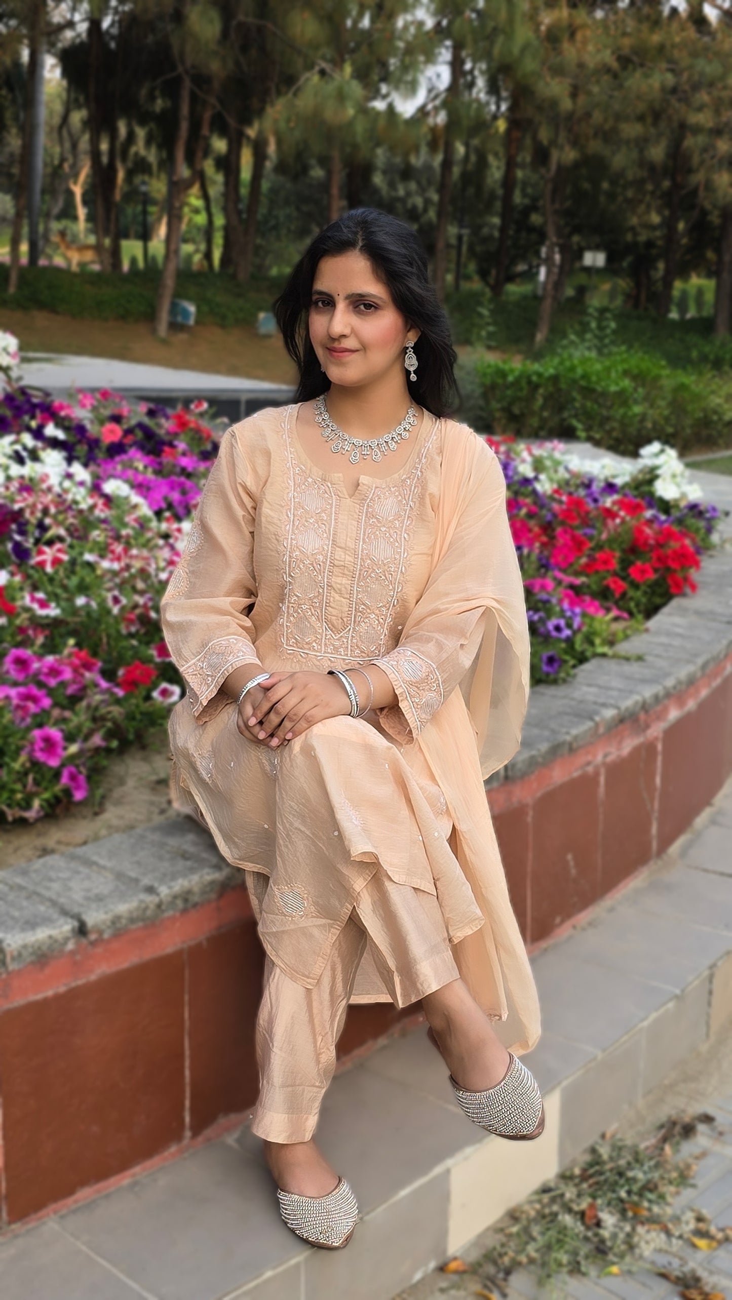 Mul chanderi chikankari suit set with emblishment of pearl and cutdana.