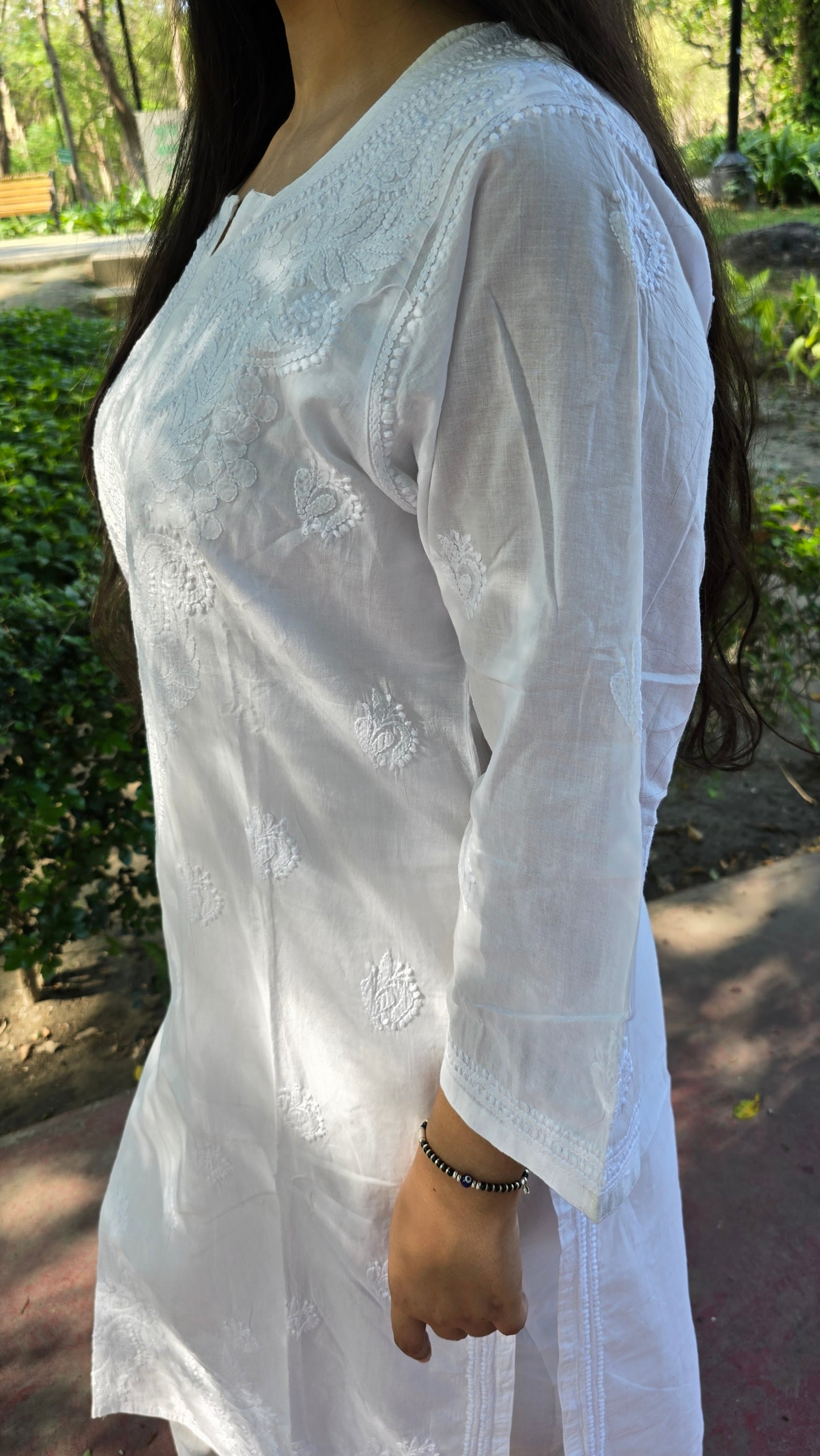 Fine chikankari on round neck with buti all over kurta
