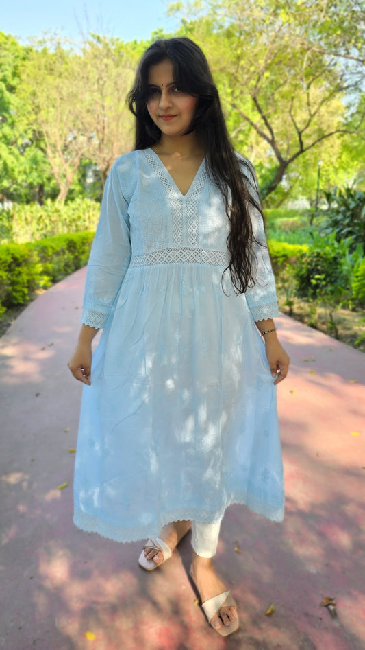V neck powder blue colour cotton chikankari A- line kurti with lase work.