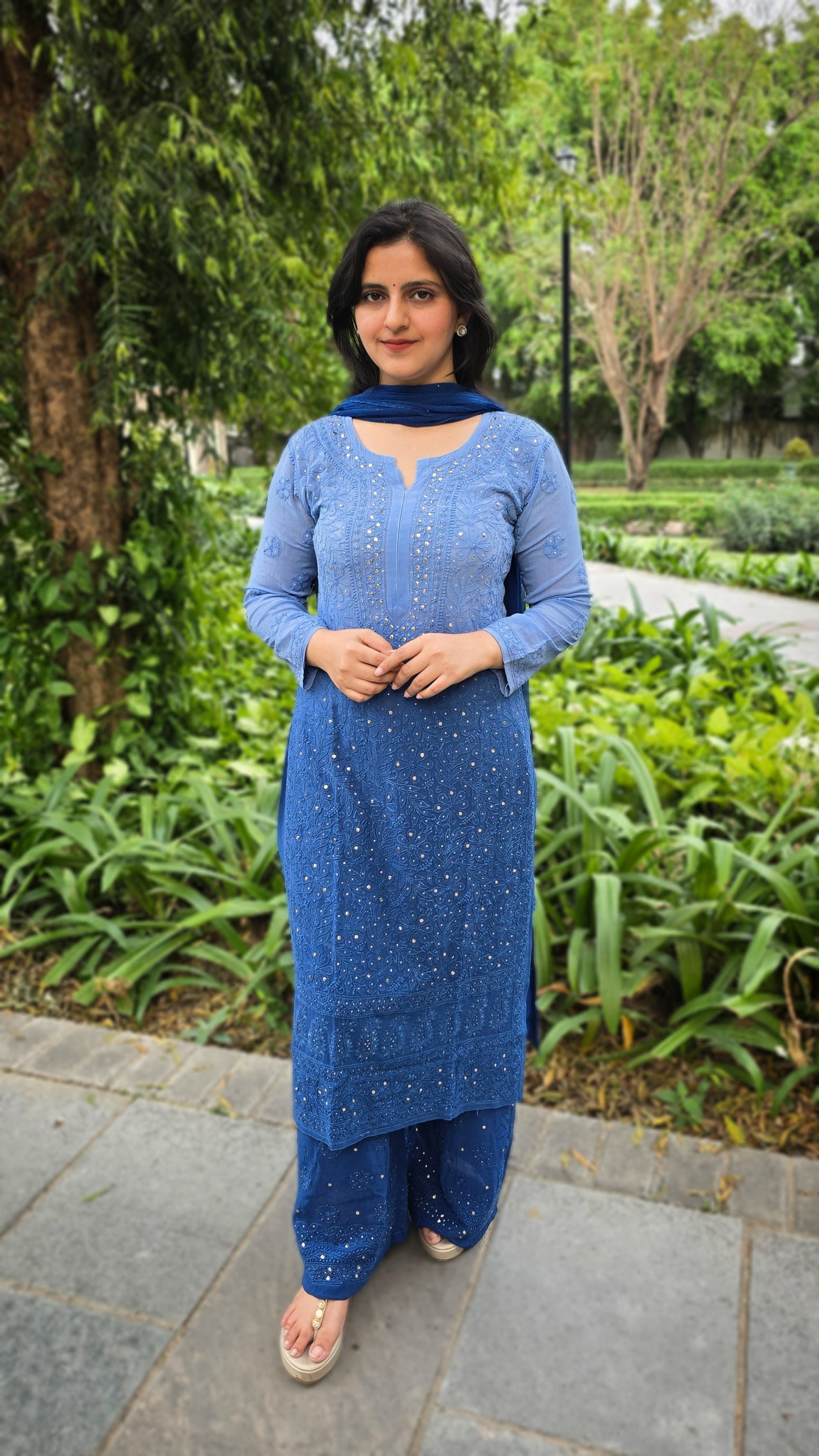 Full-jaal Chikankari kurta on Viscose Georgette with royal blue double-tone dye, featuring intricate Mukesh hand embellishment, a regal and elegant party piece.